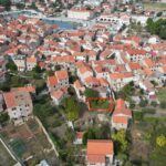 Drone photo showing building plot Stari Grad within the old town near the harbour.