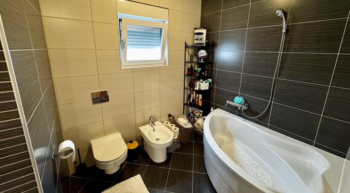Contemporary bathroom with corner tub