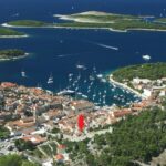 Aerial view of Hvar town and Pakleni islands with apartment location marked